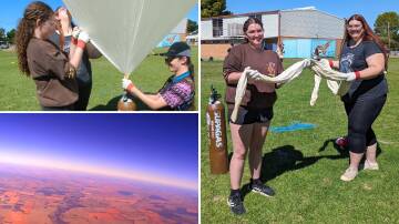 Nyngan High School science students Megan Richards (brown jumper) and Grace Williams (navy shirt) with Hunter School of the Performing Arts student Nolan Sobel-Read (hat) launching the weather balloon at Nyngan High School. Pictures supplied
