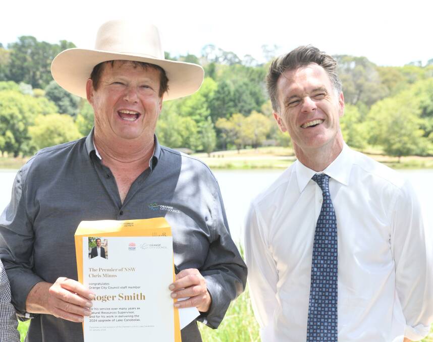 Roger Smith receives a certificate of appreciation from NSW Premier Chris Minns. Picture by Jude Keogh