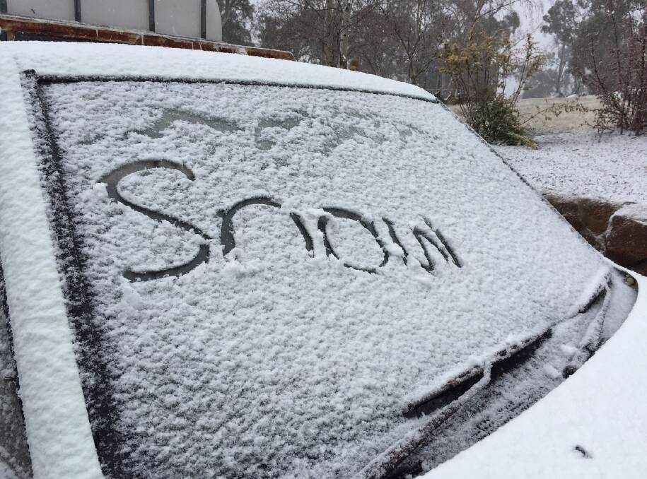 LET IT SNOW: One car in Oberon was covered in snow on Friday morning. It failed to last long, as snow struggled to settle in the town. Photo: MAUREEN LAWSON