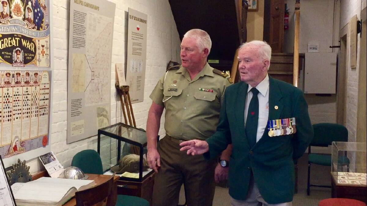 HISTORY: Army Museum of Tasmania manager Chris Talbot and volunteer Owen Winter prepare to commemorate Anzac Day. Picture: Michelle Wisbey