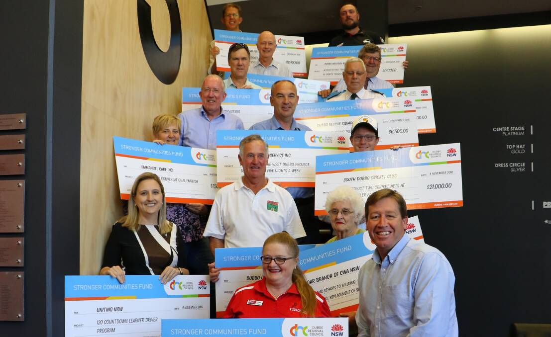 Strong Community: Michael Kneipp and Troy Grant with some of the recipients of the Stronger Communities Fund Community Grant.