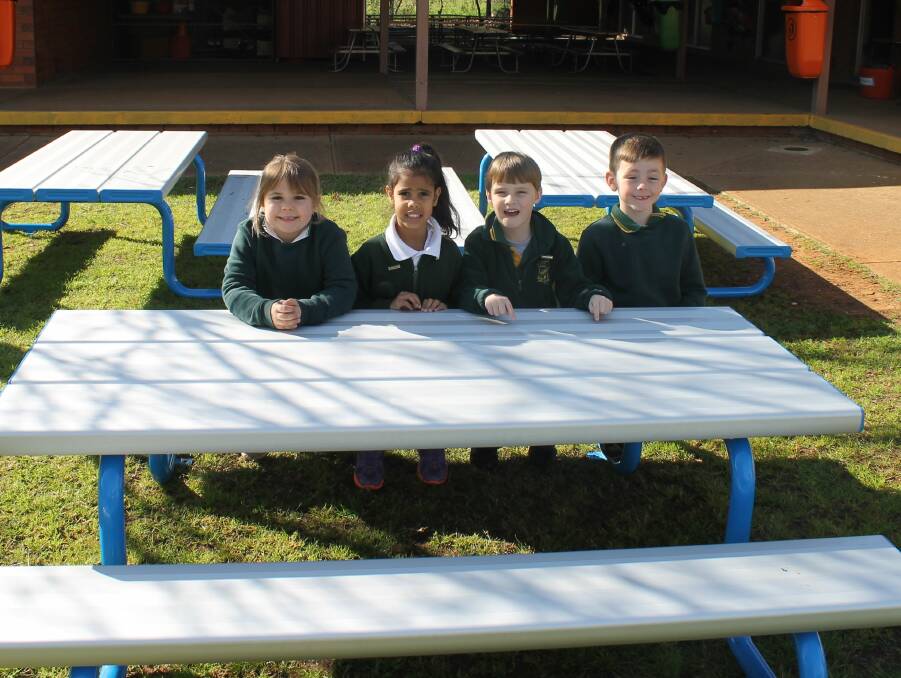 Snacking in Style: Kinder students are very impressed with their new lunch tables.