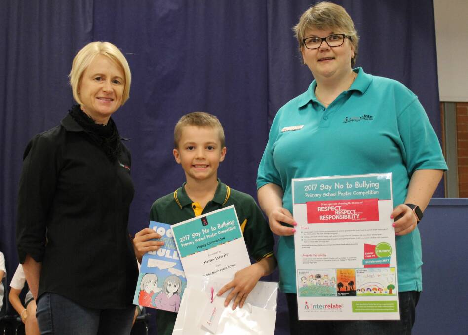 Well Done: Harley Stewart with his award winning anti-bullying prizes with the ladies from Interrelate.