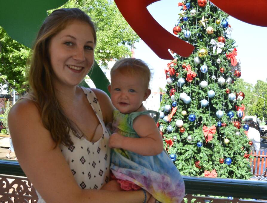 Lea and Willow Roberts admiring the giant Christmas tree in front of the rotunda, one of the highlights of the cities decorations this year. 