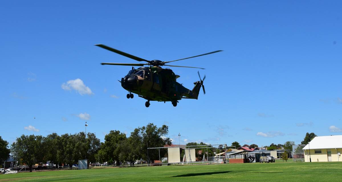 Impressive: The brand new Navy helicopter lands at No.3 Oval on Tuesday as part of a community engagement exercise. Photo: PAIGE WILLIAMS