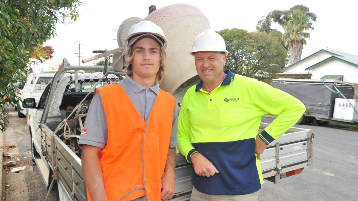 PROUD TO HELP: Apprentice bricklayer Kyuss Smith and his boss, Gary Pollack. Photo: JUDE KEOGH 0424jklife3