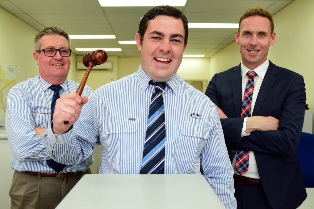 Joe Walkom (centre) will represent Orana in the NSW final of the Novice Auctioneers Competition. He will be supported by Graeme Board from Bob Berry Real Estate (left) and REINSW Orana Division chairperson Adam Wells (right).  Photo: BELINDA SOOLE
