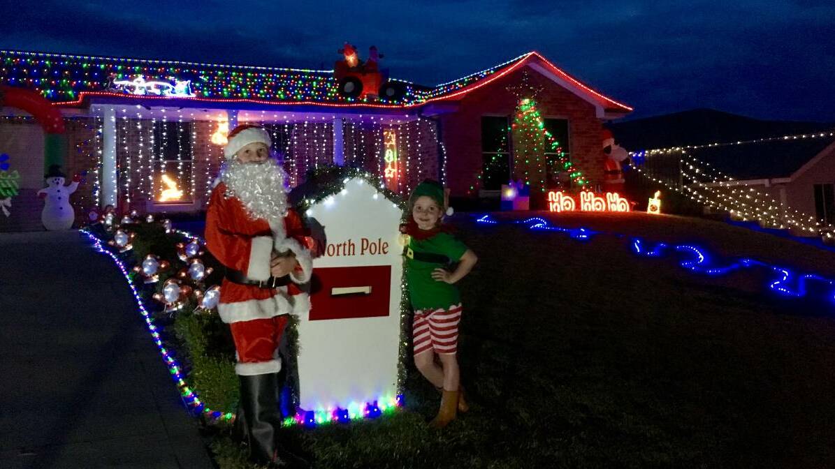 FESTIVE DUO: Jake, 10, and Piper, 8, Henry's home at 10 Musgrove Avenue is a finalist in the Put Christmas in Your Street competition. Photo: BELINDA HENRY 120916lights
