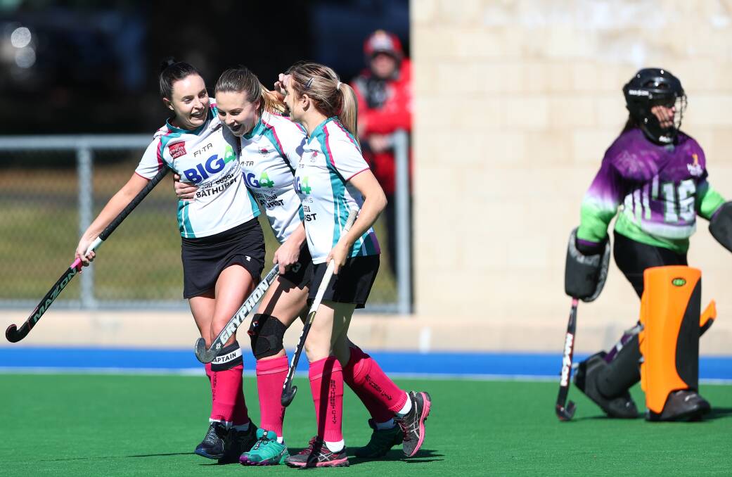NICE WORK: Bec Bosianek is congratulated by Bathurst City team-mates Kelsey Willott and Jess Hotham after scoring. Photo: PHIL BLATCH