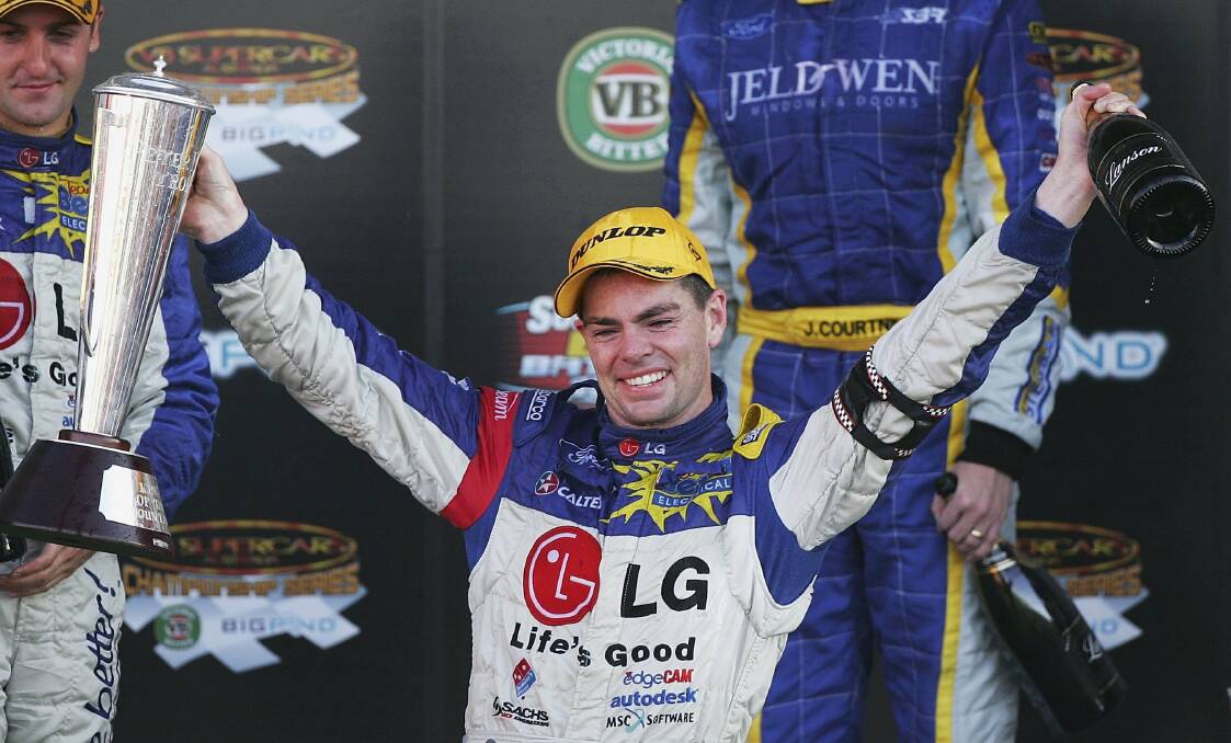 BEST of the best: An emotional Craig Lowndes holds the inaugral Brock Trophy after winning the Bathurst 1000 in 2006. Photo: Getty Images