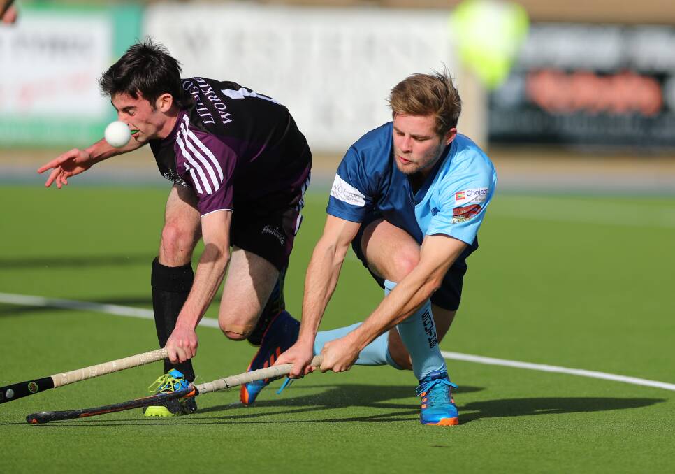 TOUGH DAY OUT: Souths' Nick McEwan fires in a shot under the nose of Panthers defender Dane Guffogg in Saturday's men's Premier League Hockey match. Photo: PHIL BLATCH 071517pbsouth3