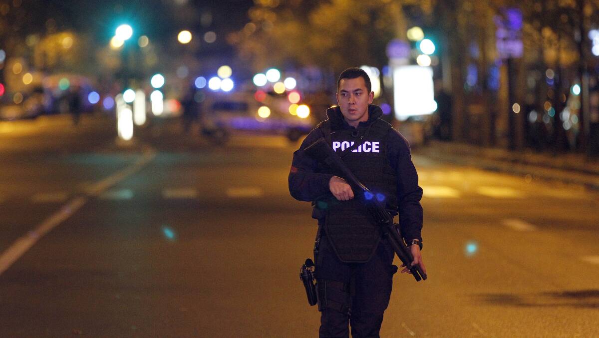 A policeman patrols near the Boulevard des Filles-du-Calvaire after an attack November 13, 2015 in Paris, France. Gunfire and explosions in multiple locations erupted in the French capital with early casualty reports indicating at least 60 dead. (Photo by Thierry Chesnot/Getty Images)