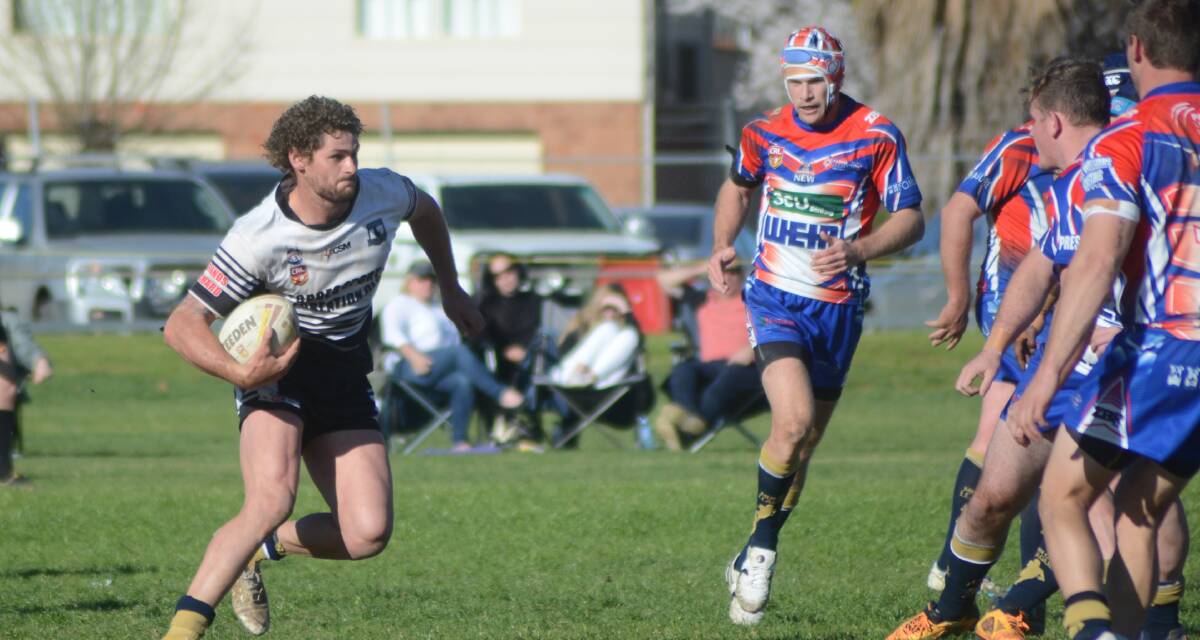 ON THE MOVE: Forbes captain Jake Grace charges towards the Parkes defence during last weekend's final round win over the Spacemen. 