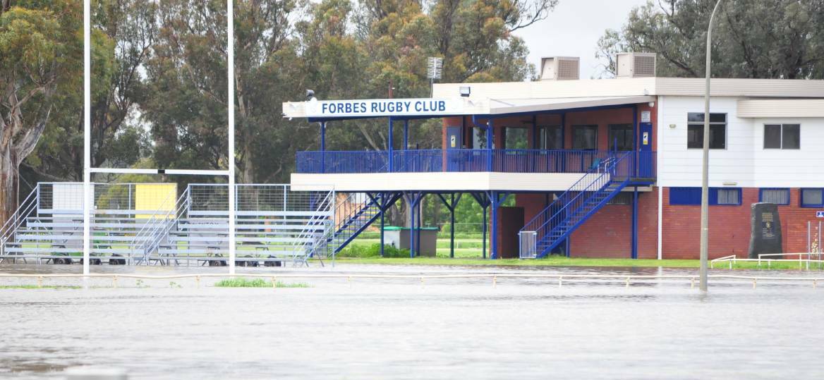 ANYONE KNOW AN ARK BUILDER: The Forbes Rugby club house and the goal posts stand alone above the flood waters rising in Platypi territory. 
