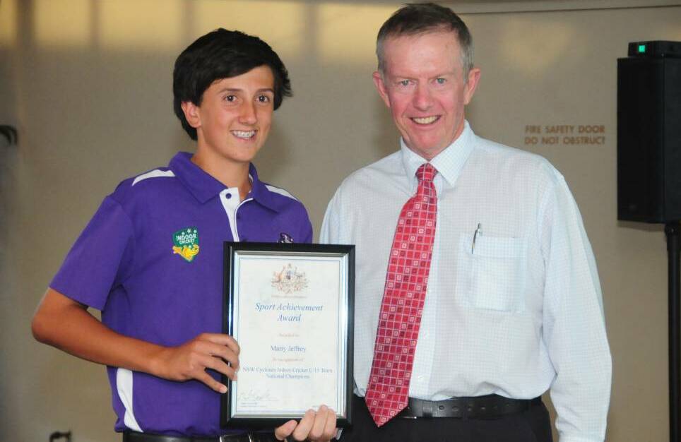SMILES: Mark Coulton presents Marty Jeffrey with a sports award in 2013. Coulton and Andrew Gee will join forces to award both Dubbo and Wellington's finest in 2016.