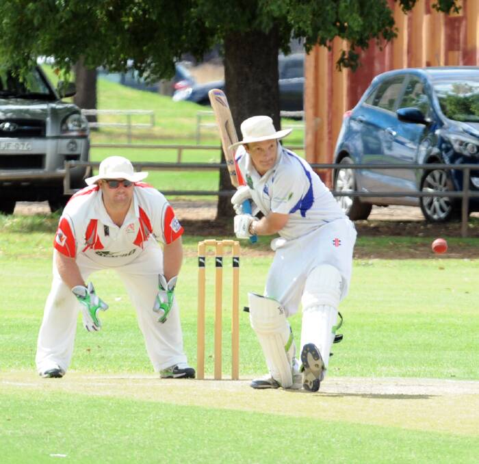 ON THE FRONT FOOT: Richie Hawker for Macquarie strides down the wicket back in March, this season the DDCA has shaken up its competition structure. Photo: BROOK KELLEHEAR-SMITH