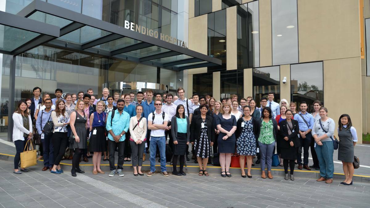 Bendigo Health chief medical officer and clinical support services executive director Dr Humsha Naidoo with interns outside the main entrance of the new Bendigo hospital.