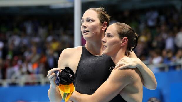 Sisters in arms: Cate and Bronte Campbell after the 100m freestyle final. Photo: Lee Jin-man

