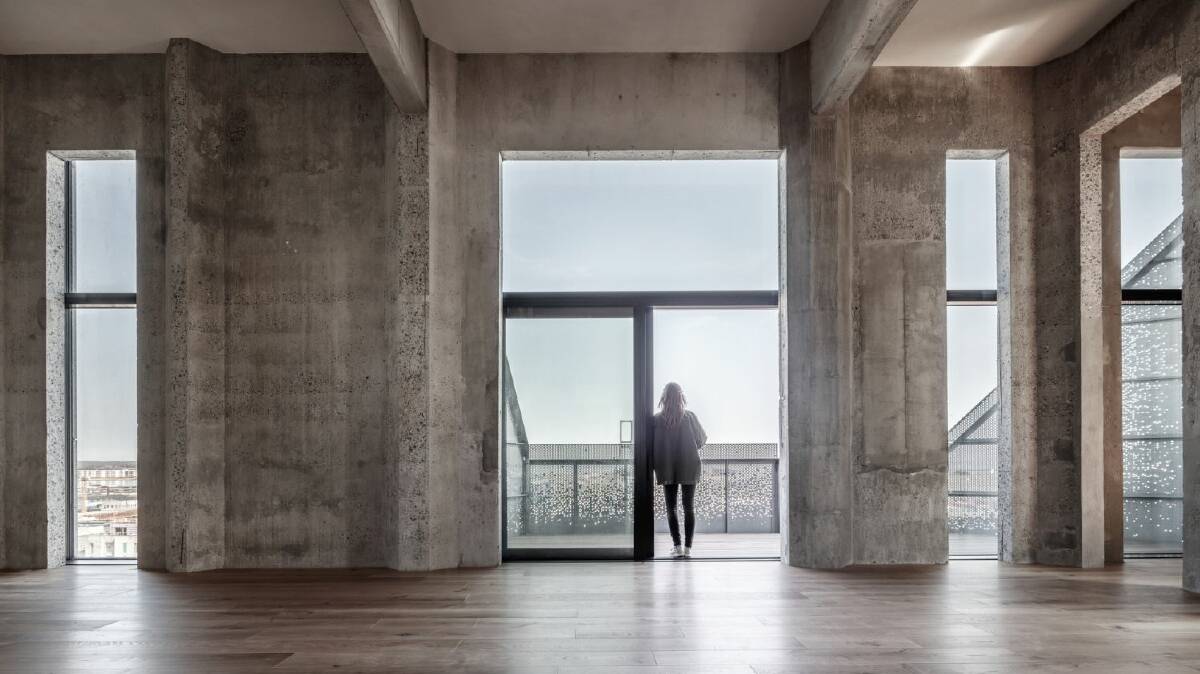 The character of the silo has been retained with largely concrete floors and walls. Photo: COBE/Rasmus Hjortshoj