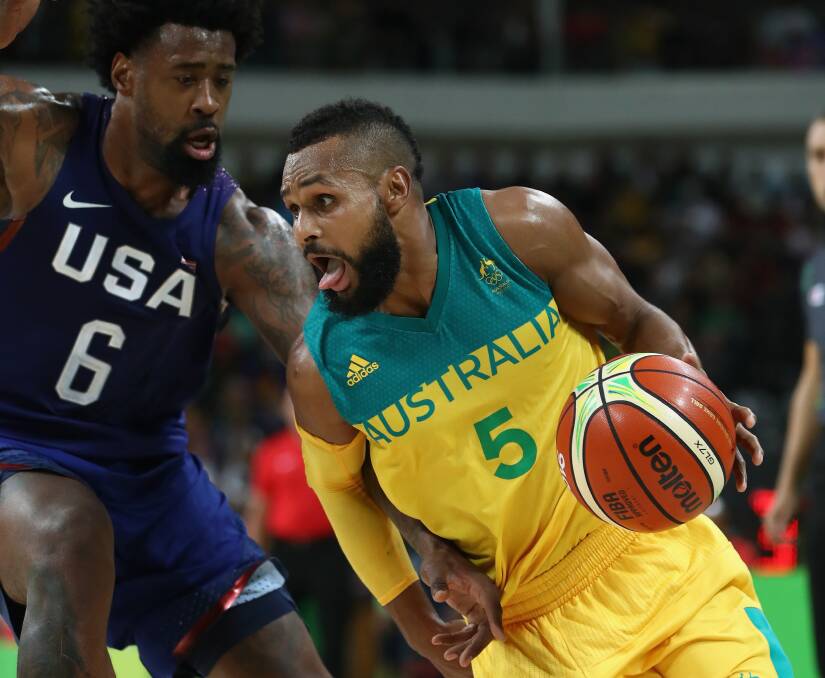 Patty Mills #5 of Australia handles the ball against DeAndre Jordan #6 of United States during the Men's Preliminary Round Group A between Australia and the United States on Day 5 of the Rio 2016 Olympic Games at Carioca Arena 1 on August 10, 2016 in Rio de Janeiro, Brazil. Photo: Phil Walter/Getty Images