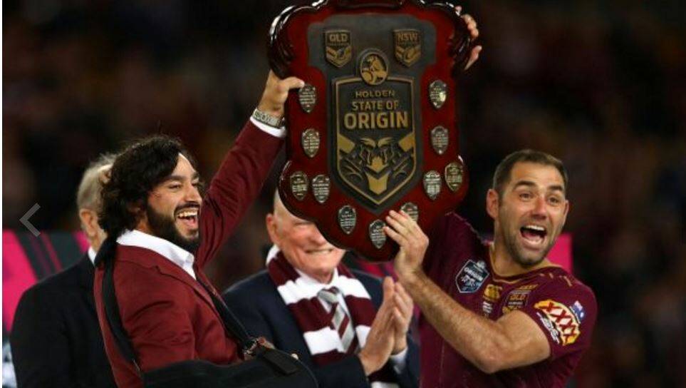Johnathan Thurston and Cameron Smith with the State of Origin spoils.