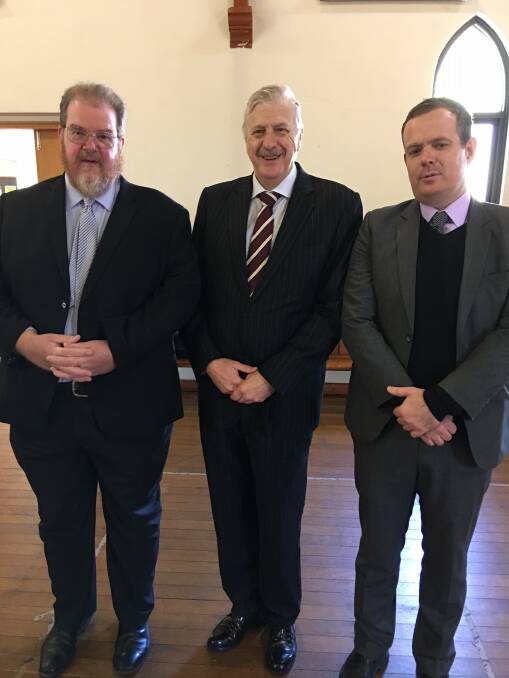 FOND FAREWELL: Crown prosecutor Chris Bailey with Judge Gordon Lerve and barrister Stephen Lawrence. Photo: CONTRIBUTED