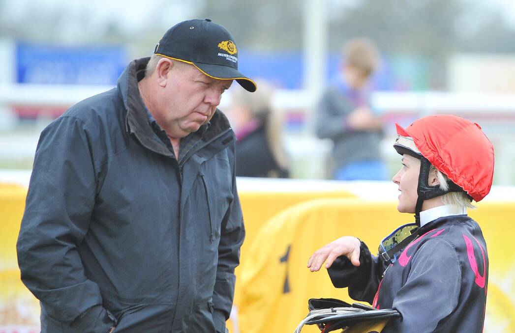 CHANCES: Brett Cavanough talking to jockey Chelsea McFarlane. Cavanough will saddle up two runners in Monday's Coonabarabran Cup. Photo: DAILY ADVERTISER