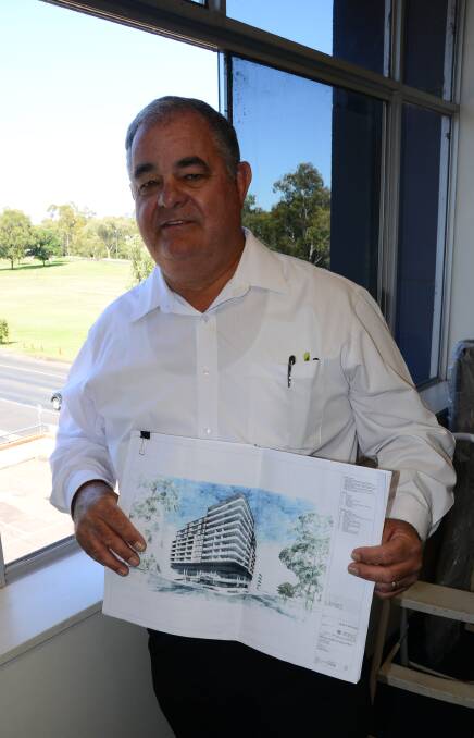 LONG-TERM VISION: John Walkom with plans for a $28 million unit complex development at the 1 Church Street site it will be built on. Photo: BEN WALKER