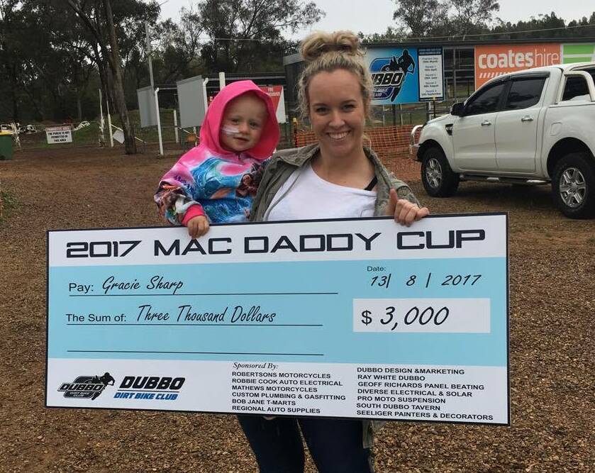 GREAT WORK: Grace Sharp with her aunty Jenna Goatcher, and a special cheque for $3000. Photo: CONTRIBUTED
