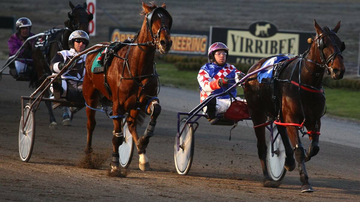 CHASING HARD: Allnight Mlady (right) holds out Karloo Threeothree in a down-to-the-wire finish at Bathurst Paceway recently. Photo: PHIL BLATCH