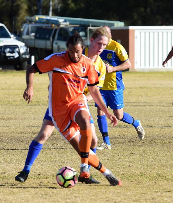 Alex Richardson on the ball for Dubbo FC during their match against South Dubbo Wanderers on Sunday. Photo: PAIGE WILLIAMS