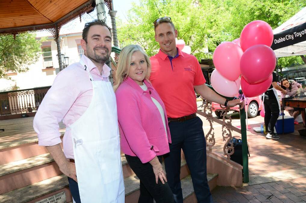 Adam Wells (right) with Ben Thompson and Tracy Bevan at Pink Up Dubbo last week. Photo: PAIGE WILLIAMS