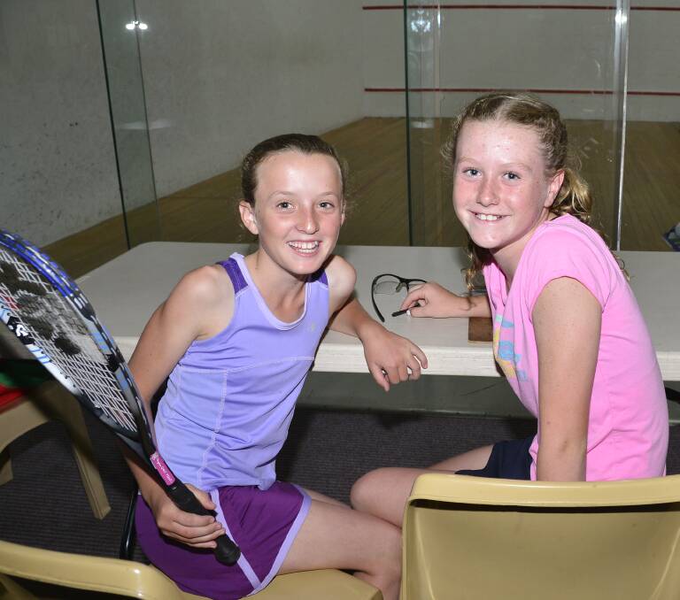 YOUNG GUNS: Hallie Hogden and  Meg Christensen enjoying their squash at Dubbo RSL Club. Photo: BELINDA SOOLE
