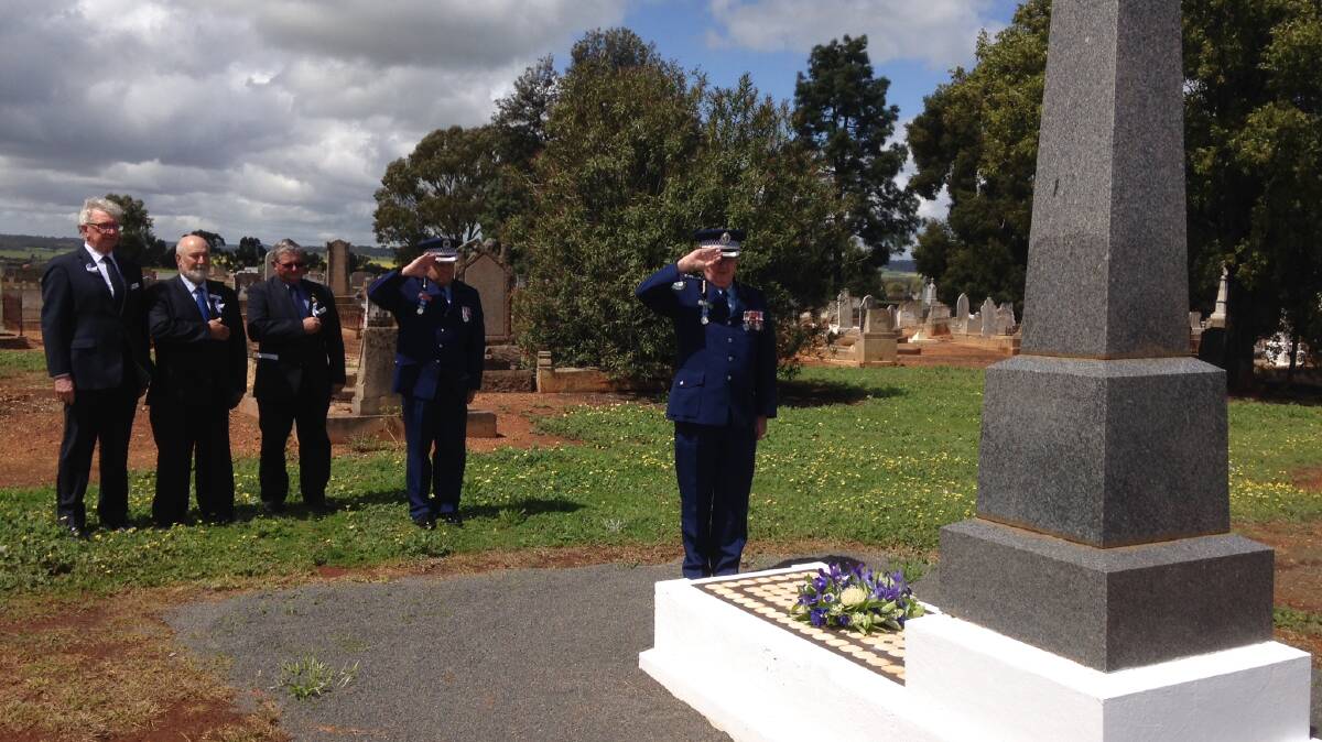 RESPECT: On a day when the community pauses to remember its fallen police officers, Cr Bill Jayet, mayor Ken Keith, Lachlan Shire mayor John Medcalf, Chief Inspector Dave Cooper and Superintendent Chris Taylor (front) paid their respects to fallen Tottenham police officer George Duncan who was murdered 100 years ago.
