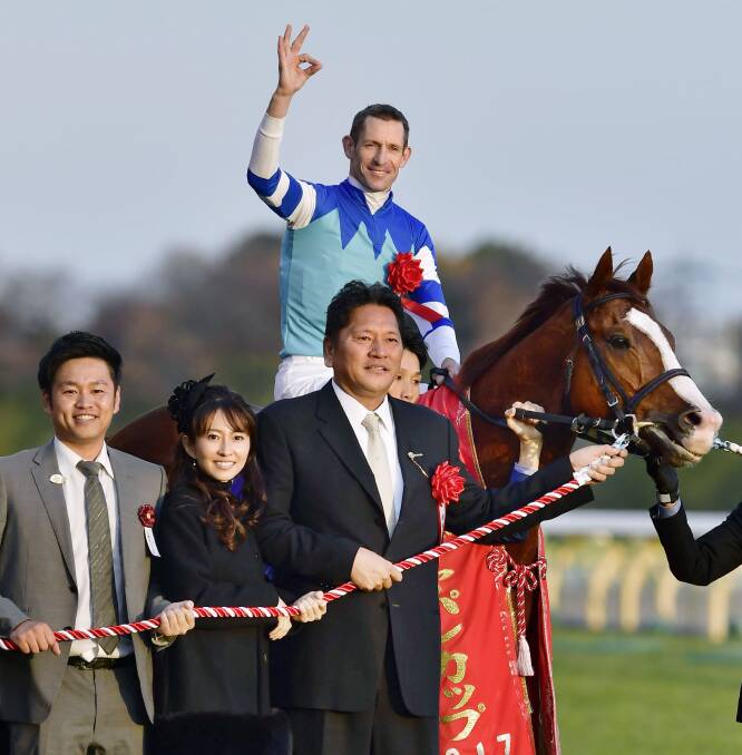 SUPERSTAR: Hugh Bowman with the connections of Cheval Grand after winning the Japan Cup. Bowman will officially be crowned the world's best jockey this week.