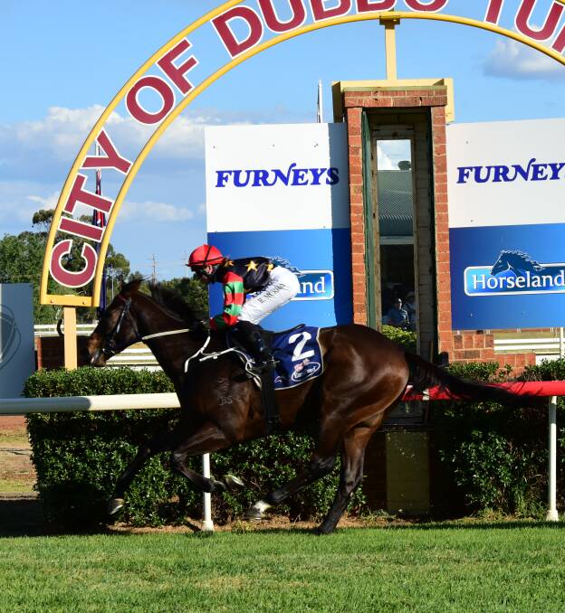 WINNER: The Garry Lunn-trained Ghibli crosses the line first in the Dubbo RSL Sunset Bistro at Dubbo on Sunday. Photo: PAIGE WILLIAMS
