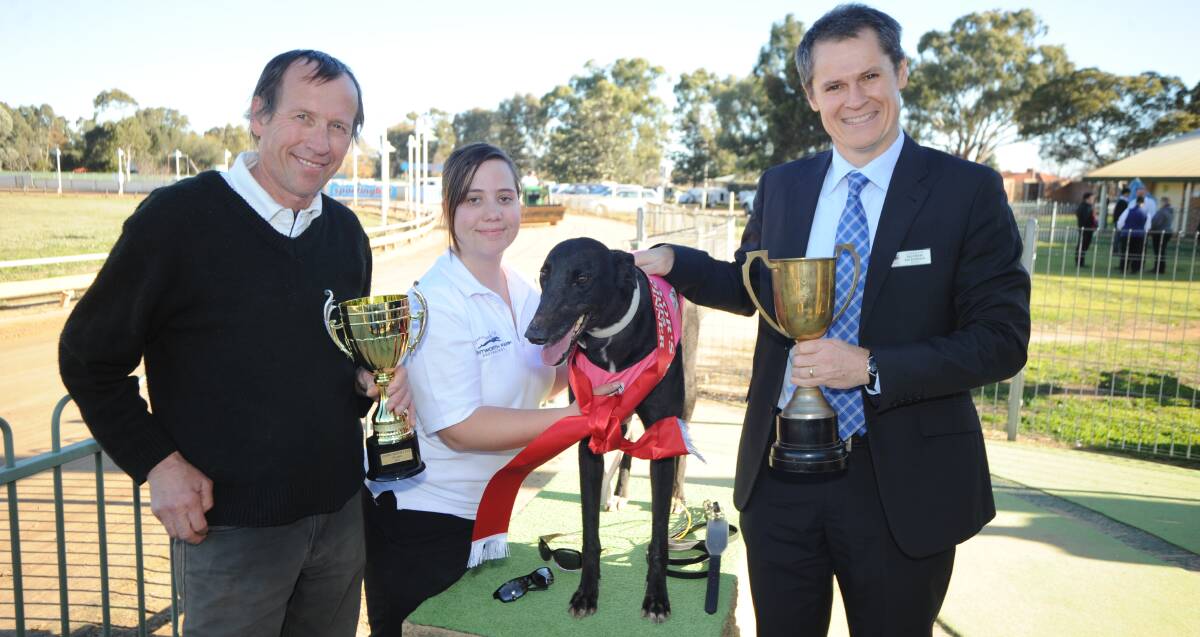 Tradition: Mathew Dickerson (right) with Len and Samantha Haaring after Isabel Enlim won the 2014 Dubbo Mayors Cup at Dawson Park.