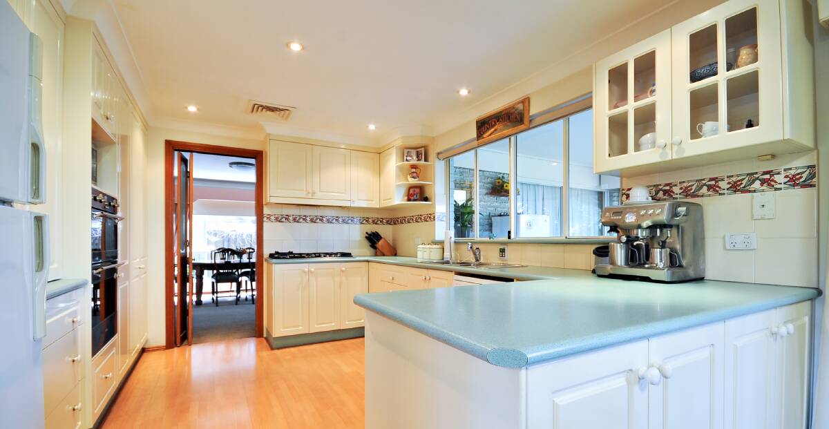 PREPARATION AREA: This elegant, well-designed kitchen is the perfect place to whip up some lovely meals.