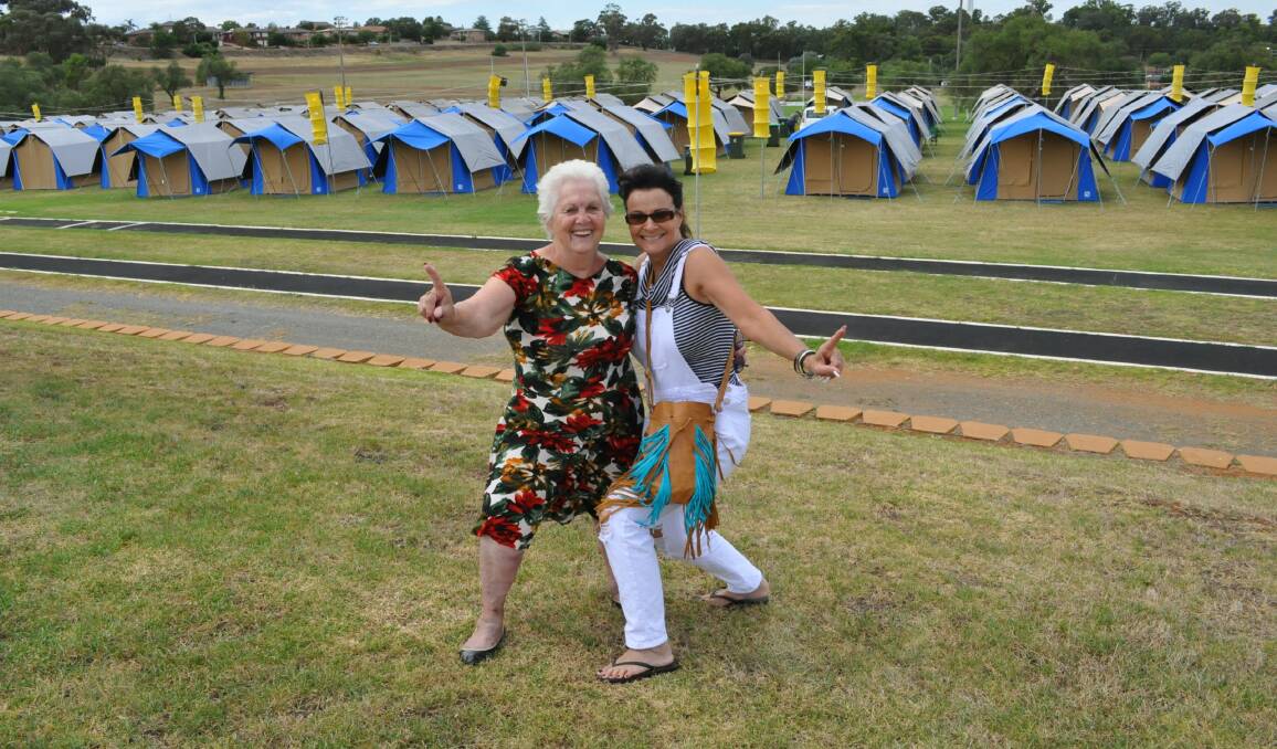 BURNING LOVE: Darwin residents Elva Wood and Shiralee Black channelled their inner Elvis at Gracelands on the Green at Northparkes Oval. Photo: EMILY BENNETT