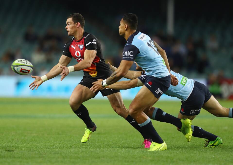 SUPER: Jesse Kriel of the Bulls passes as he is tackled during the recent round 12 Super Rugby match between the Waratahs and the Bulls. (Photo by Mark Kolbe/Getty Images)
