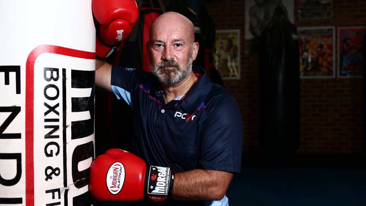 John Robertson stepped into the ring on March 31 this year to raise money for Blacktown PCYC, an organisation he has vocally supported. Picture: Geoff Jones