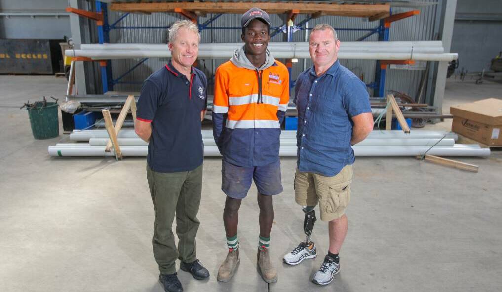 ON THE JOB: Emmanuel College's David Gladman, apprentice Mar Gattek, 17, and Southern Victorian Plumbing's Darren Smith at Mar's workplace. Picture: Morgan Hancock