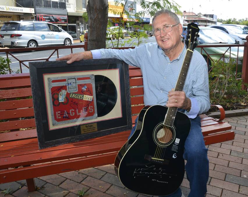 PRIZES: Dubbo man, Barry Joseph, with the signed memorabilia to be raffled off at Sunday's concert. Photo: BELINDA SOOLE