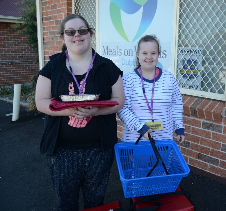 MEALS ON WHEELS: Anna Gibson and Emily Gardner of Dubbo have each been volunteers with Meals on Wheels Dubbo for around three years and were interviewed this week as part of National Volunteer Week. Both girls take pride in their work and are adored by clients. Photo: ELOUISE HAWKEY
