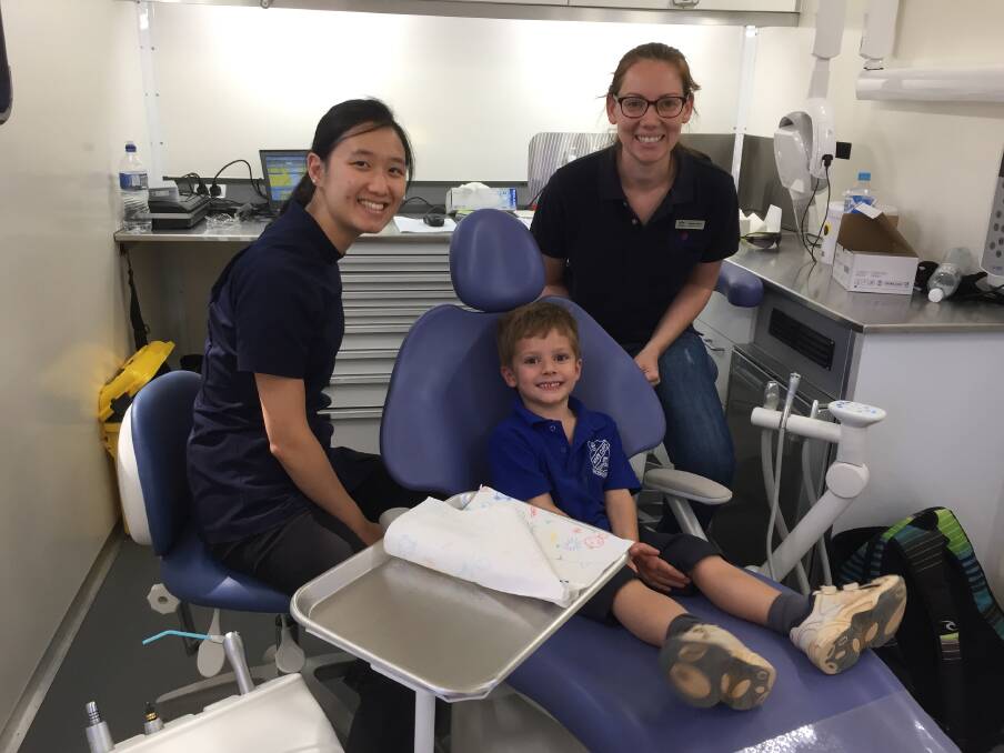 ON THE MOVE: Liam Taylor of White Cliffs Public school was attended to by Dubbo staff in the new mobile dental clinic van. Photo: Contributed