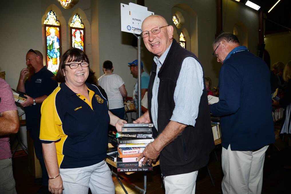 HELPING HANDS: Rotary Club of Dubbo's Lorraine Croft and Allan Clarke ensured the Michael Egan Memorial Book Fair ran smoothly on Saturday. Photo: BELINDA SOOLE 