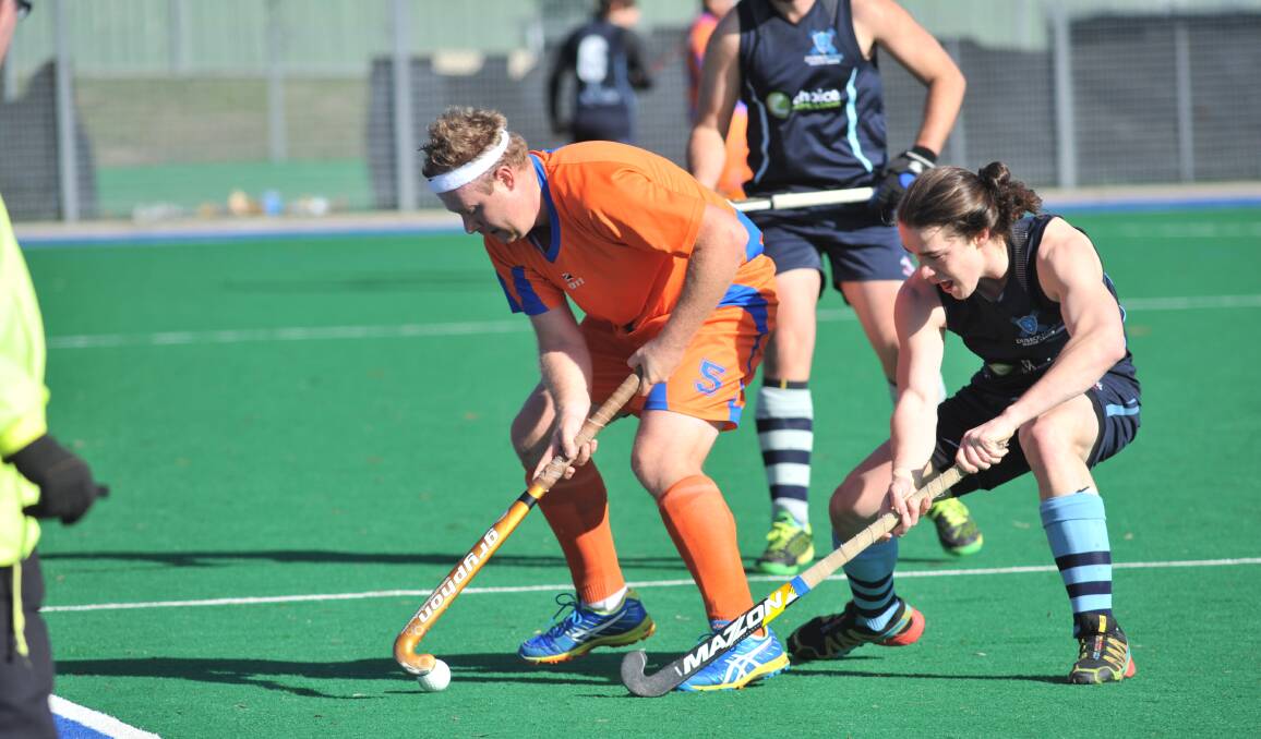 BACK ON TRACK: Player-coach Matt Johnson looks for space in his side's 3-0 win over Dubbo on Saturday, which lifts Wanderers back into the competition's top four. Photo: JUDE KEOGH 0625jkhockey2