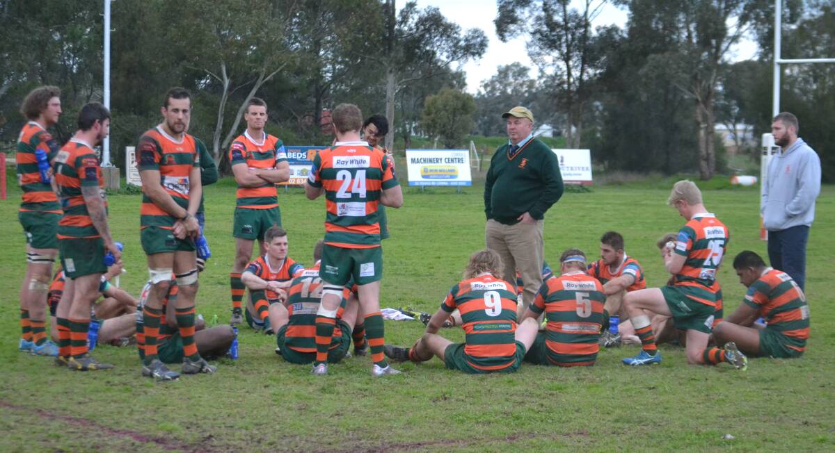 SECOND STRAIGHT LOSS: The disappointed Lions squad dissects Saturday's loss to Cowra. Photo: PETE GUTHRIE