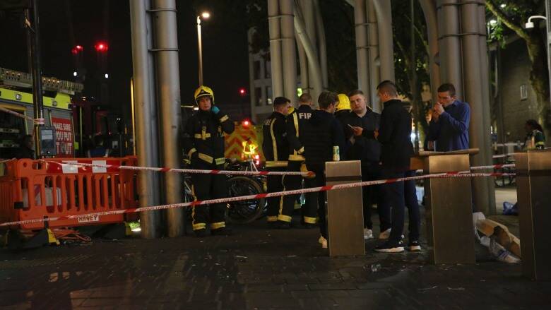 Emergency services at Stratford Centre in east London, following a suspected noxious substance attack in which at least six people were injured.
Photo: AP
