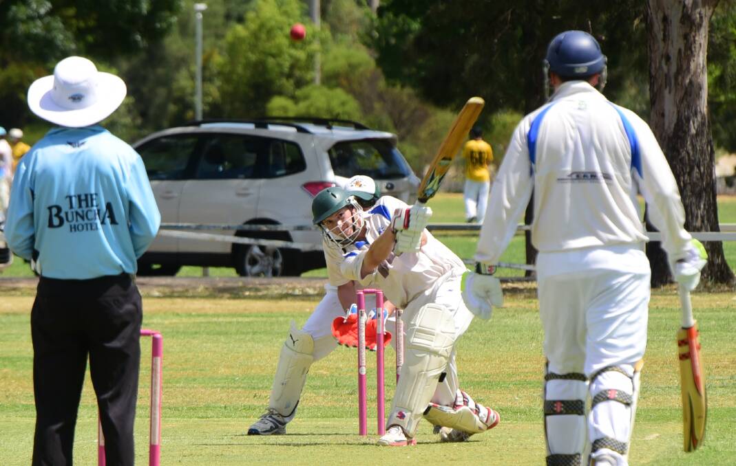 Macquarie's Cody Hannelly takes the long handle to the Souths bowling during their Pinnington Cup match.